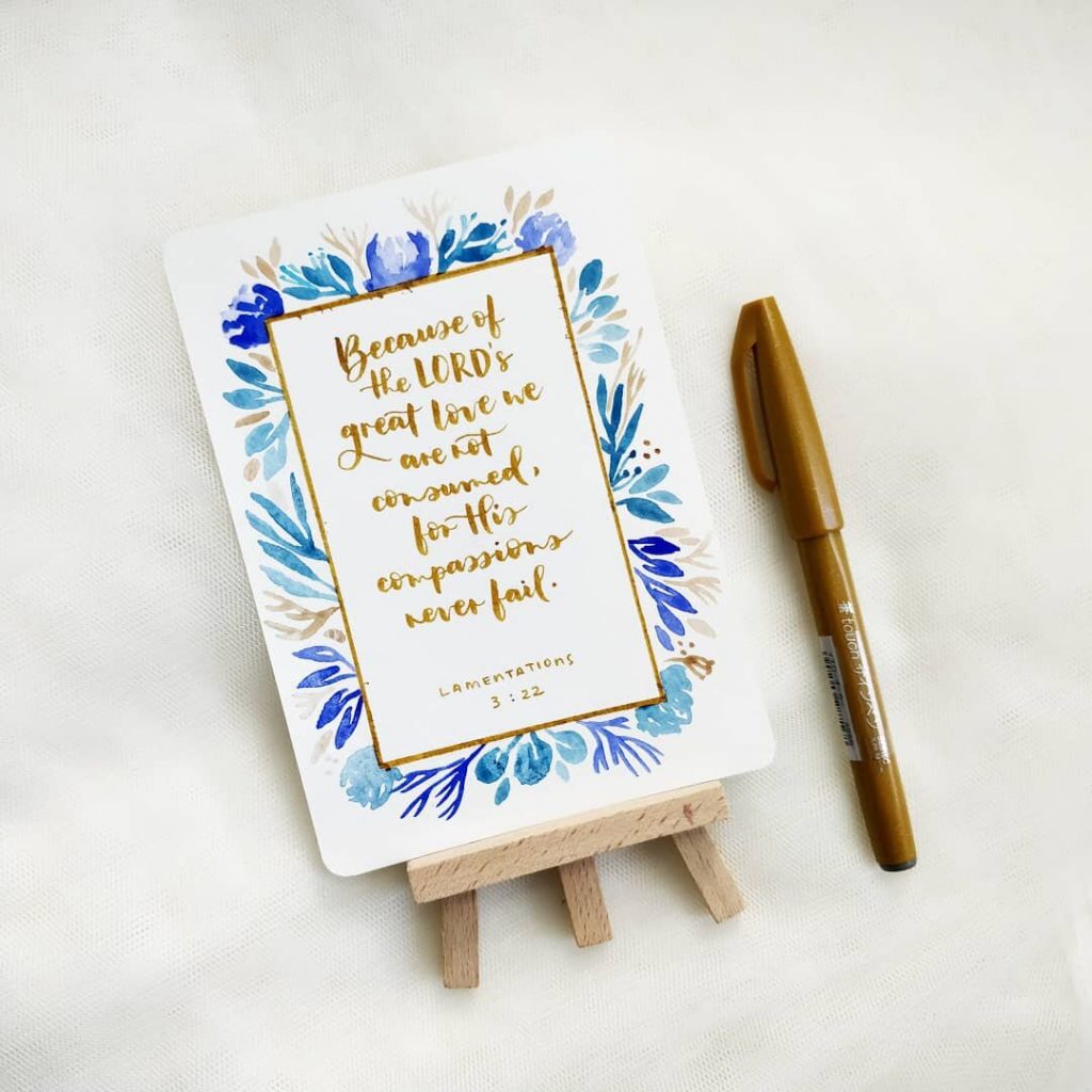 Rectangular botanical watercolor frame around brush lettering