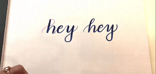 Ascender loop brush lettering